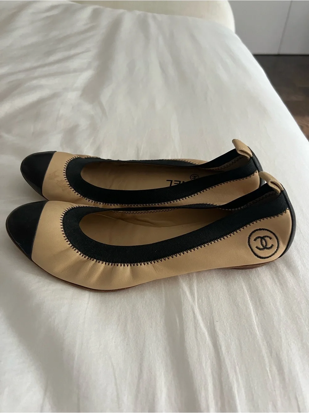 CHANEL Beige Leather Ballet Flats with Black Cap Toe
